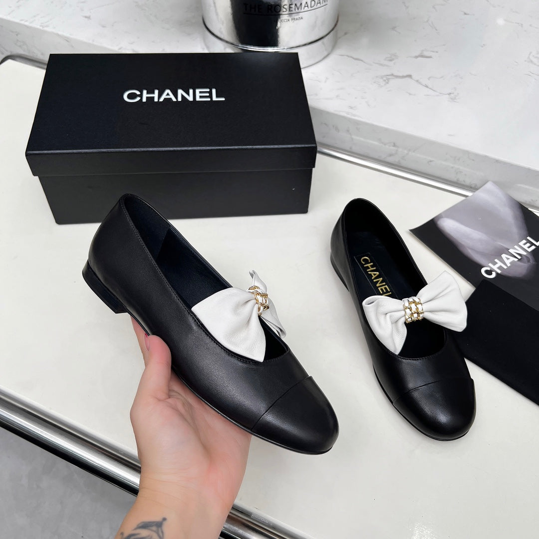 CHANEL 25S MARY JANES IN BLACK CALFSKIN WITH WHITE BOW GOLD HARDWARE